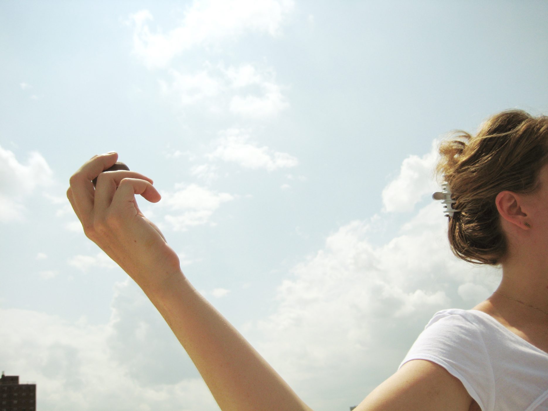 Image of woman throwing seed bomb